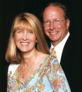 A man and woman posing for a picture.